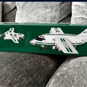 Two Green and White Hess Toy Airplane